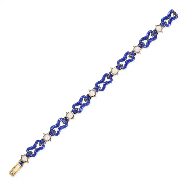 AN ANTIQUE PEARL, ENAMEL AND DIAMOND BRACELET in yellow gold and silver, comprising links relieved