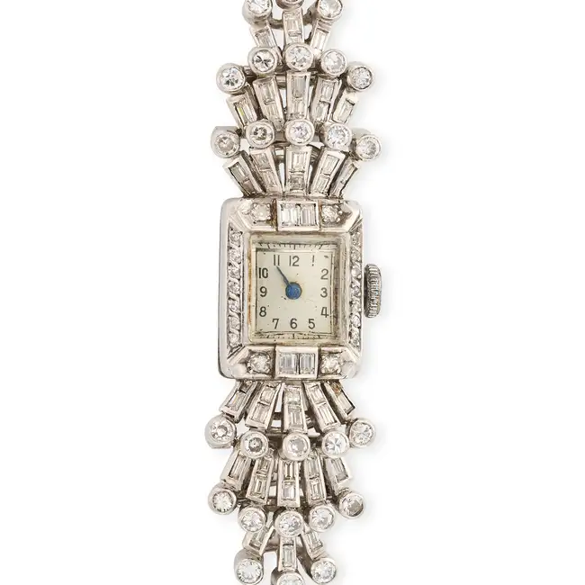 A RETRO DIAMOND COCKTAIL WATCH the rectangular face with Arabic numerals, within a border of