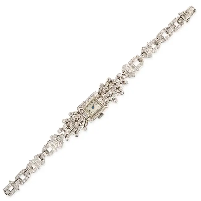 A RETRO DIAMOND COCKTAIL WATCH the rectangular face with Arabic numerals, within a border of