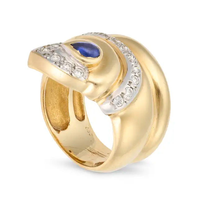 NO RESERVE - A SAPPHIRE AND DIAMOND SNAKE RING in 14ct yellow gold, designed as a coiled snake,
