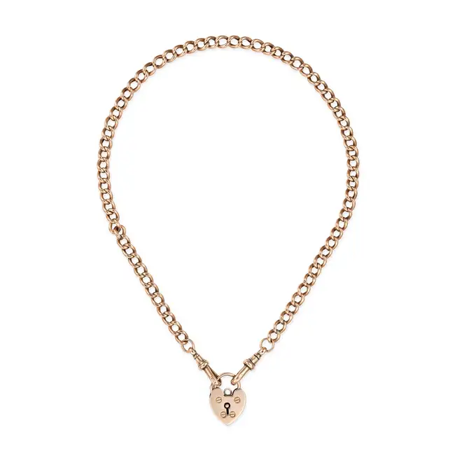AN ANTIQUE HEART PADLOCK NECKLACE in 9ct yellow gold, comprising a curb chain, suspending a heart