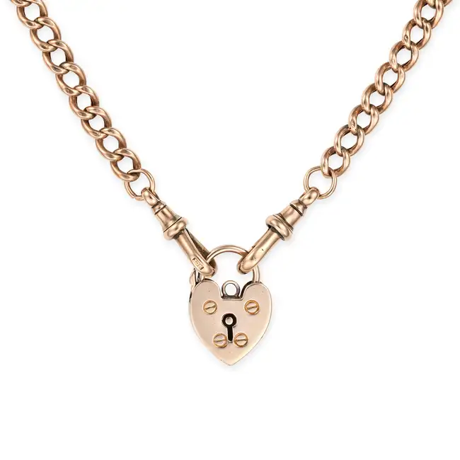 AN ANTIQUE HEART PADLOCK NECKLACE in 9ct yellow gold, comprising a curb chain, suspending a heart