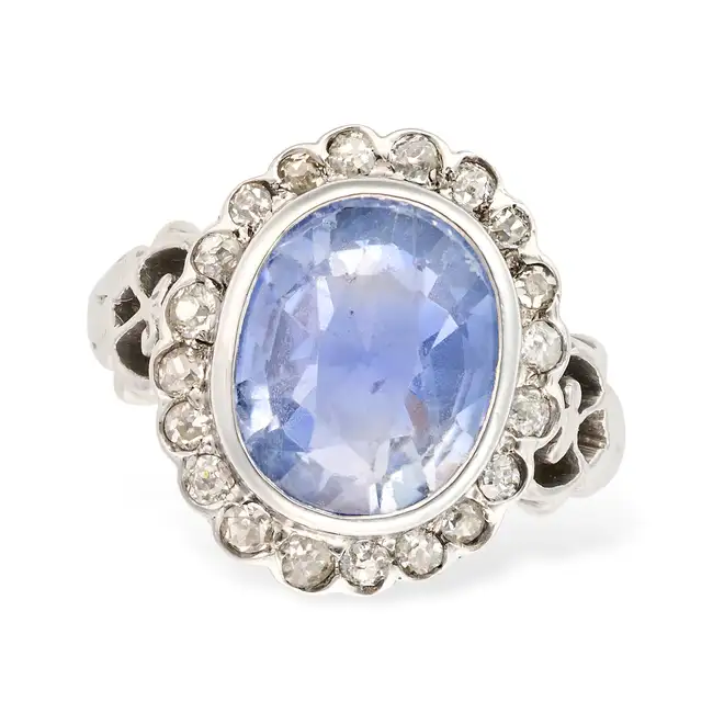 NO RESERVE - A SAPPHIRE AND DIAMOND RING set with a cushion cut sapphire of approximately 4.60