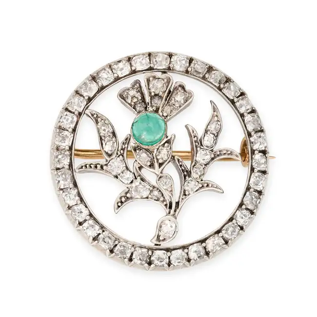 AN ANTIQUE EMERALD AND DIAMOND THISTLE BROOCH designed as a thistle set with a cabochon emerald
