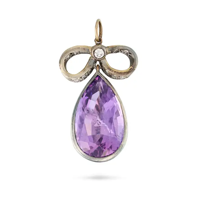 AN AMETHYST AND DIAMOND PENDANT the pendant designed as a bow set with round brilliant and single