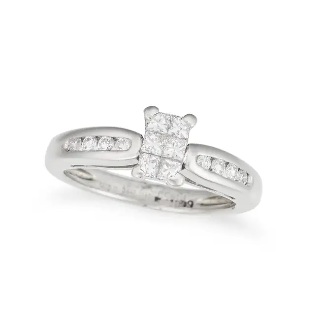 A DIAMOND DRESS RING in platinum, comprising a cluster of princess cut diamonds, the band set with