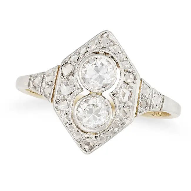 A DIAMOND DRESS RING in Art Deco design, the geometric ring set with two round brilliant cut