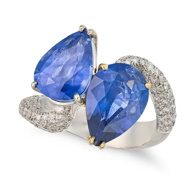 AN ITALIAN SAPPHIRE AND DIAMOND TOI ET MOI RING set with two pear cut sapphires of approximately 3.