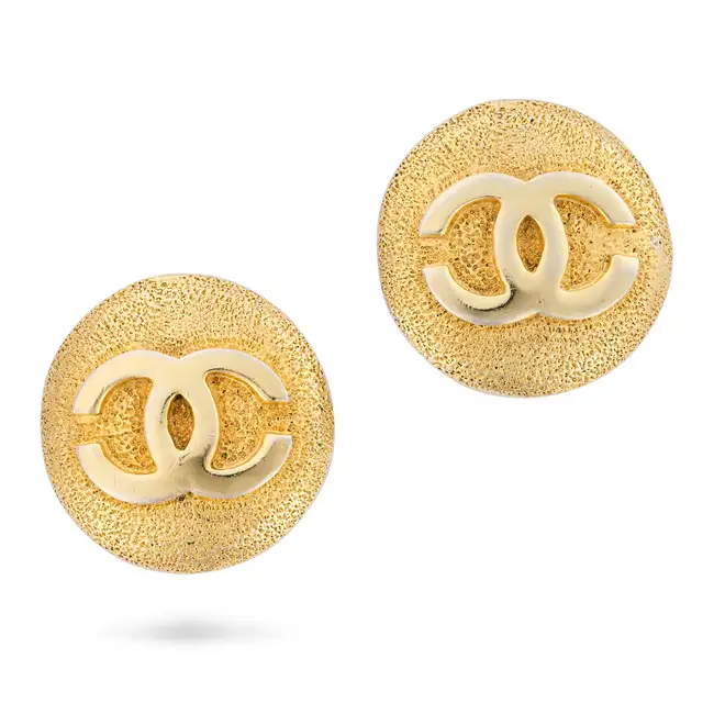 CHANEL, A PAIR OF TEXTURED CC STUD EARRINGS each comprising a circular textured gold tone metal stud