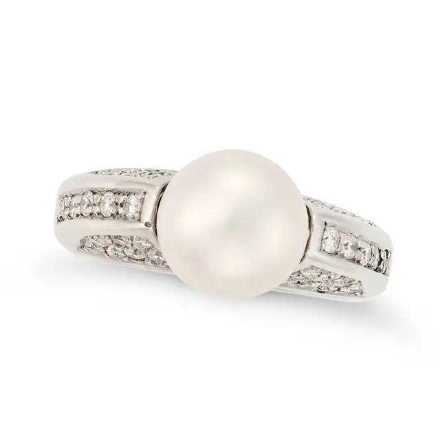 A PEARL AND DIAMOND DRESS RING in 18ct white gold, set with a pearl of 9.7mm, accented by pave set
