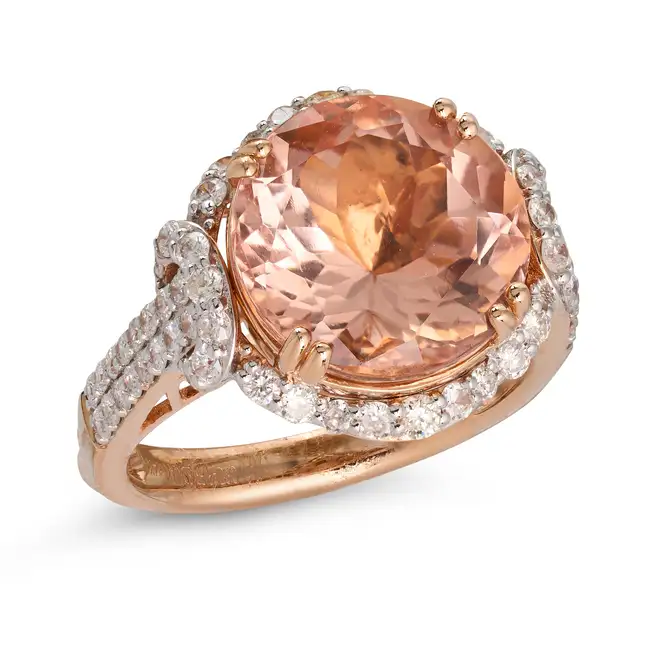 OSCAR FRIEDMAN, A MORGANITE AND DIAMOND CLUSTER RING set with a round cut morganite of 6.31 carats
