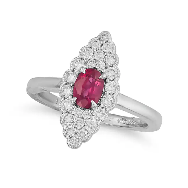 A RUBY AND DIAMOND NAVETTE RING the navette face set with a cushion cut ruby of 0.73 carats,
