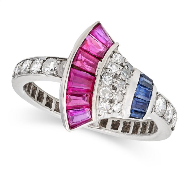 AN ART DECO RUBY, SAPPHIRE AND DIAMOND DRESS RING in platinum, the Egyptian revival style face set with tapered baguette and baguette cut rubies and sapphires, accented by old, single, and round brilliant cut diamonds, no assay marks, size L1/2 / 6, 
