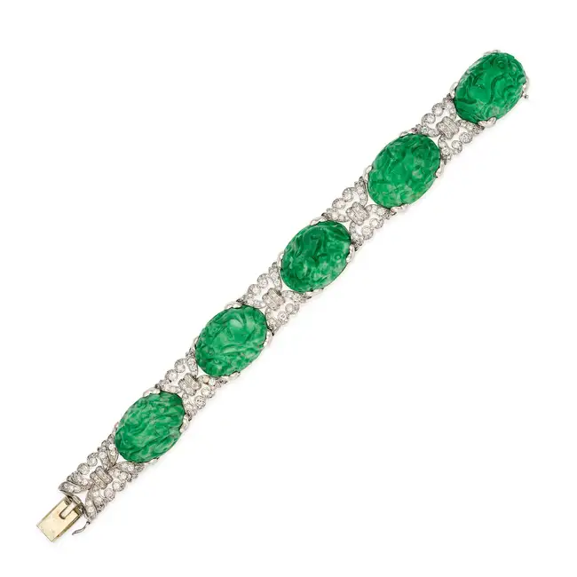 A CHINESE CARVED JADEITE JADE AND DIAMOND BRACELET set with five Chinese carved jadeite jade