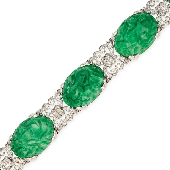 A CHINESE CARVED JADEITE JADE AND DIAMOND BRACELET set with five Chinese carved jadeite jade