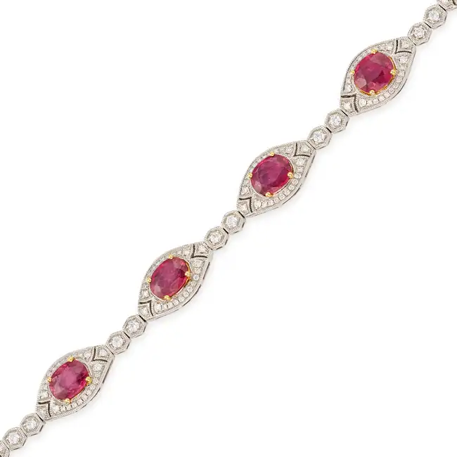 A FINE FANCY COLOURED SAPPHIRE AND DIAMOND BRACELET in 18ct white gold, comprising seven navette