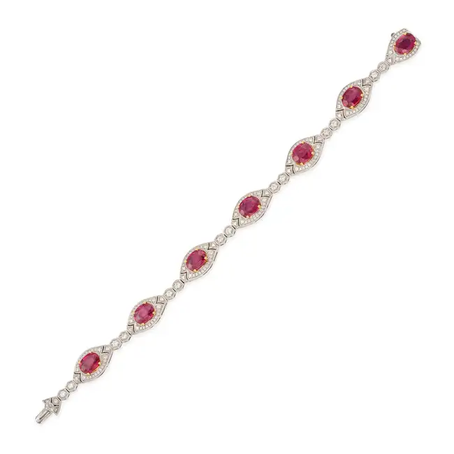 A FINE FANCY COLOURED SAPPHIRE AND DIAMOND BRACELET in 18ct white gold, comprising seven navette