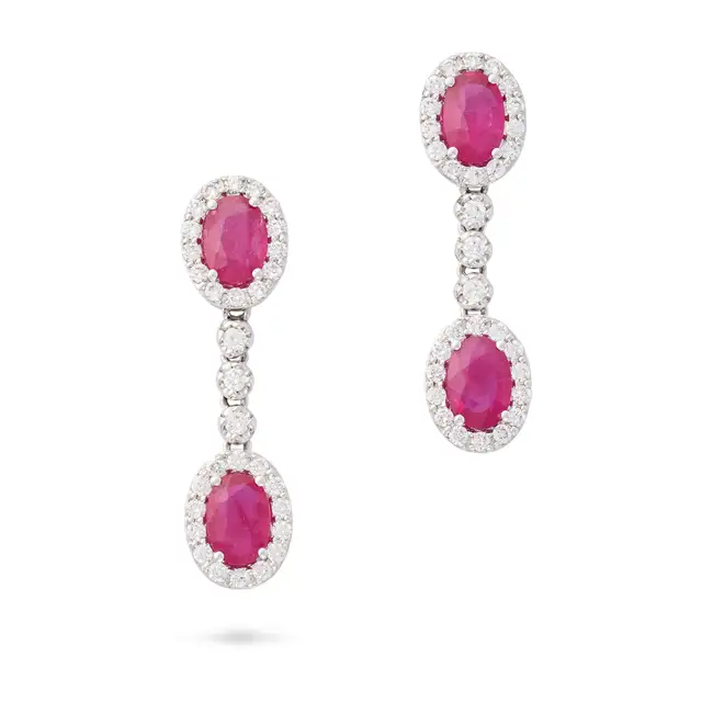 NO RESERVE - A PAIR OF RUBY AND DIAMOND DROP EARRINGS in 18ct white gold, each of articulated