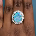 SALAVETTI, AN IMPORTANT UNTREATED 7.93 CARAT BLACK OPAL AND DIAMOND CLUSTER RING in 18ct white gold,
