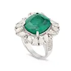 A FINE 10.27 CARAT ZAMBIAN MINOR EMERALD AND DIAMOND RING set with a cushion cut emerald of 10.27