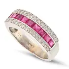 NO RESERVE - A RUBY AND DIAMOND HALF ETERNITY RING in 18ct white gold, set with a row of square step