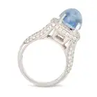 NO RESERVE - A SAPPHIRE AND DIAMOND DRESS RING in 18ct white gold, set with an oval cabochon