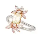 A YELLOW AND PINK DIAMOND RING set with an emerald cut yellow diamond, accented by sprays of