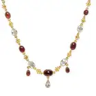 AN ANTIQUE GARNET AND AQUAMARINE NECKLACE comprising a trace chain set with oval cabochon garnets