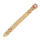 MAUBOUSSIN, A FINE VINTAGE RUBY, EMERALD AND DIAMOND BRACELET in 18ct yellow gold, comprising a
