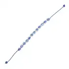 NO RESERVE - A PORCELAIN BEAD BRACELET comprising a row of painted blue and white porcelain beads,