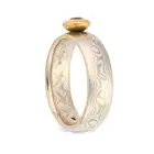 NO RESERVE - A SCOTTISH AMETHYST RING in silver, the stylised band set with a round cut amethyst,
