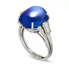 AN IMPORTANT 16.34 CARAT BURMA NO HEAT SAPPHIRE AND DIAMOND DRESS RING in platinum, set with an oval