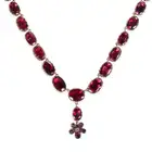 AN ANTIQUE GARNET RIVIERE NECKLACE the necklace comprising a row of oval and cushion cut garnets,