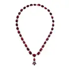 AN ANTIQUE GARNET RIVIERE NECKLACE the necklace comprising a row of oval and cushion cut garnets,