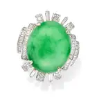​AN UNTREATED JADEITE JADE AND DIAMOND RING set with an oval cabochon jadeite jade of