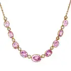 AN ANTIQUE PINK TOPAZ AND PEARL NECKLACE  comprising a row of alternating oval cut pink topaz and