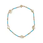 A PEARL AND ENAMEL BRACELET comprising a row of batons decorated with turquoise enamel, punctuated