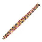 A VINTAGE RUBY, SAPPHIRE AND DIAMOND BRACELET in 18ct yellow gold, comprising fluted links, accented
