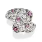 A FINE ALEXANDRITE AND DIAMOND DRESS RING the crossover ring in openwork foliate design, set with