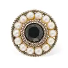 TIFFANY & CO., A ZIEGFELD COLLECTION PEARL AND ONYX RING in silver, set with a facetted onyx in a