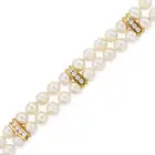 NO RESERVE - A PEARL AND DIAMOND BRACELET in 18ct yellow gold and white gold, comprising two rows of
