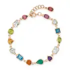 A MULTI GEM BRACELET comprising a row of oval, heart, square step, pear, octagonal step, round and