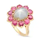 A STAR SAPPHIRE, RUBY AND DIAMOND CLUSTER RING set with an oval cabochon star sapphire of 8.30