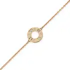 TIFFANY & CO., A DIAMOND ATLAS BRACELET comprising a circular disc with cut out Roman numerals,