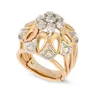 A VINTAGE FRENCH DIAMOND DRESS RING in 18ct yellow gold and platinum, designed as a stylised flower,