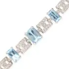A VINTAGE AQUAMARINE AND DIAMOND BRACELET comprising a row of geometric links set with round