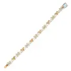 AN ANTIQUE DIAMOND, AQUAMARINE AND ENAMEL BRACELET comprising a row of scrolling links and links