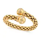 A LARGE DIAMOND BANGLE in crossover design, the tubular bangle comprising rows of fancy links,