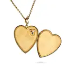 AN ANTIQUE RUBY, SAPPHIRE AND DIAMOND HEART LOCKET PENDANT NECKLACE the locket designed as a