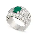 BULGARI, AN EMERALD AND DIAMOND RING in platinum, set with an octagonal step cut emerald of 1.45